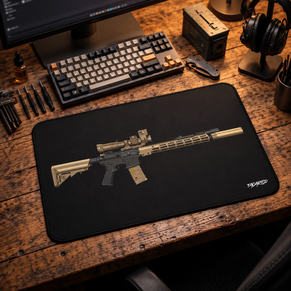 Black URGI rifle desk mat on a wood workbench with a keyboard and headphones