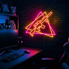 Rifle Offset Triangles LED neon sign in the Solar Flare colorway, mounted on a brick wall in a gaming room