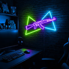 AK Split Triangles LED neon sign in the Toxic Circuit colorway, mounted on a brick wall in a gaming room