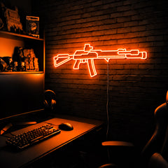 AK v6 LED neon sign in Orange on a clear backerboard in the TacArtCo gaming room