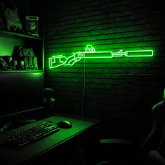 Suppressed Lever Gun LED neon sign in Green on a clear backerboard in the TacArtCo gaming room