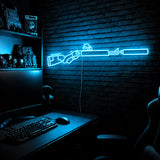 Suppressed Lever Gun LED neon sign in Ice Blue on a clear backerboard in the TacArtCo gaming room