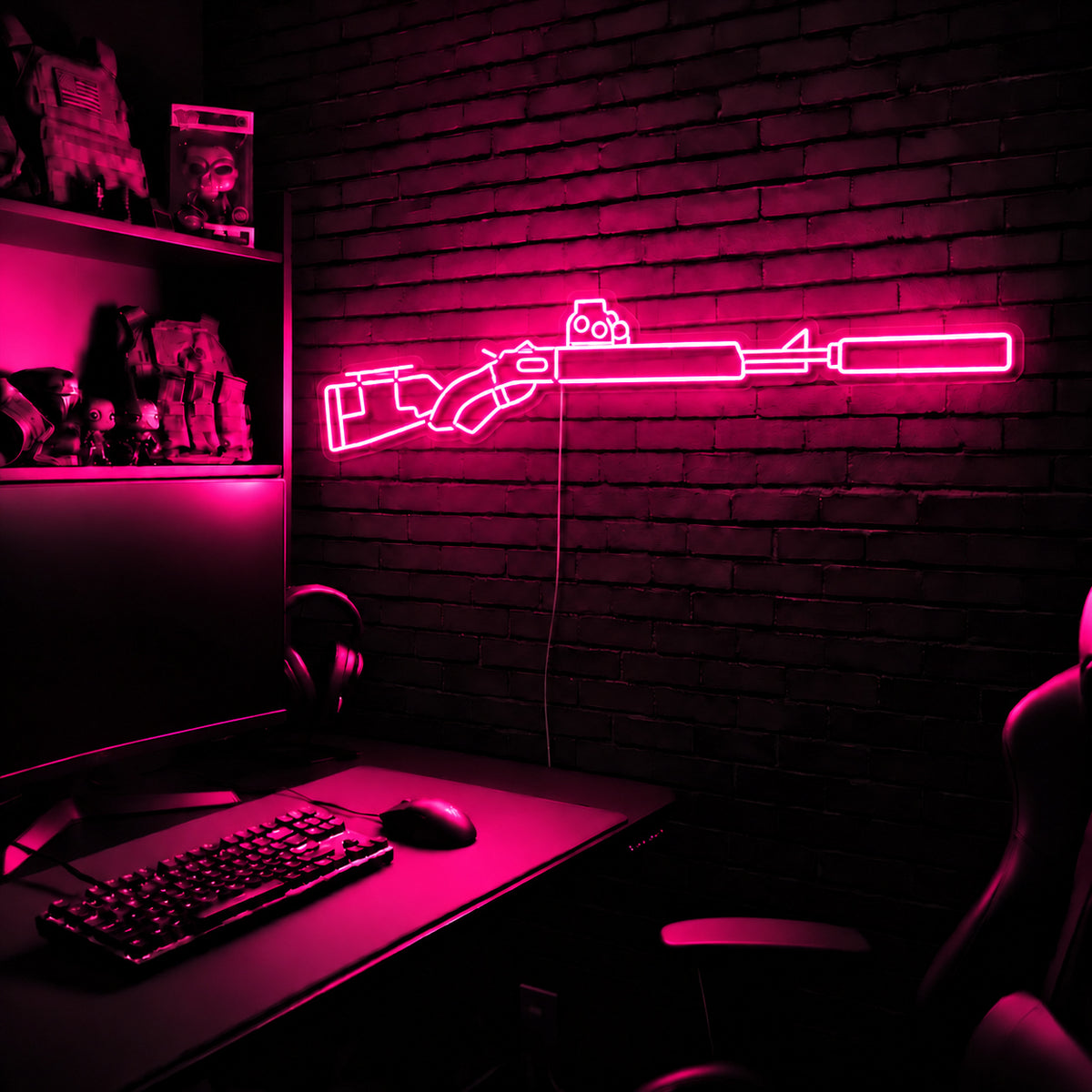 Suppressed Lever Gun LED neon sign in Pink on a clear backerboard in the TacArtCo gaming room