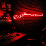 Suppressed Lever Gun LED neon sign in Red on a clear backerboard in the TacArtCo gaming room